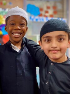 two boys smiling at camera